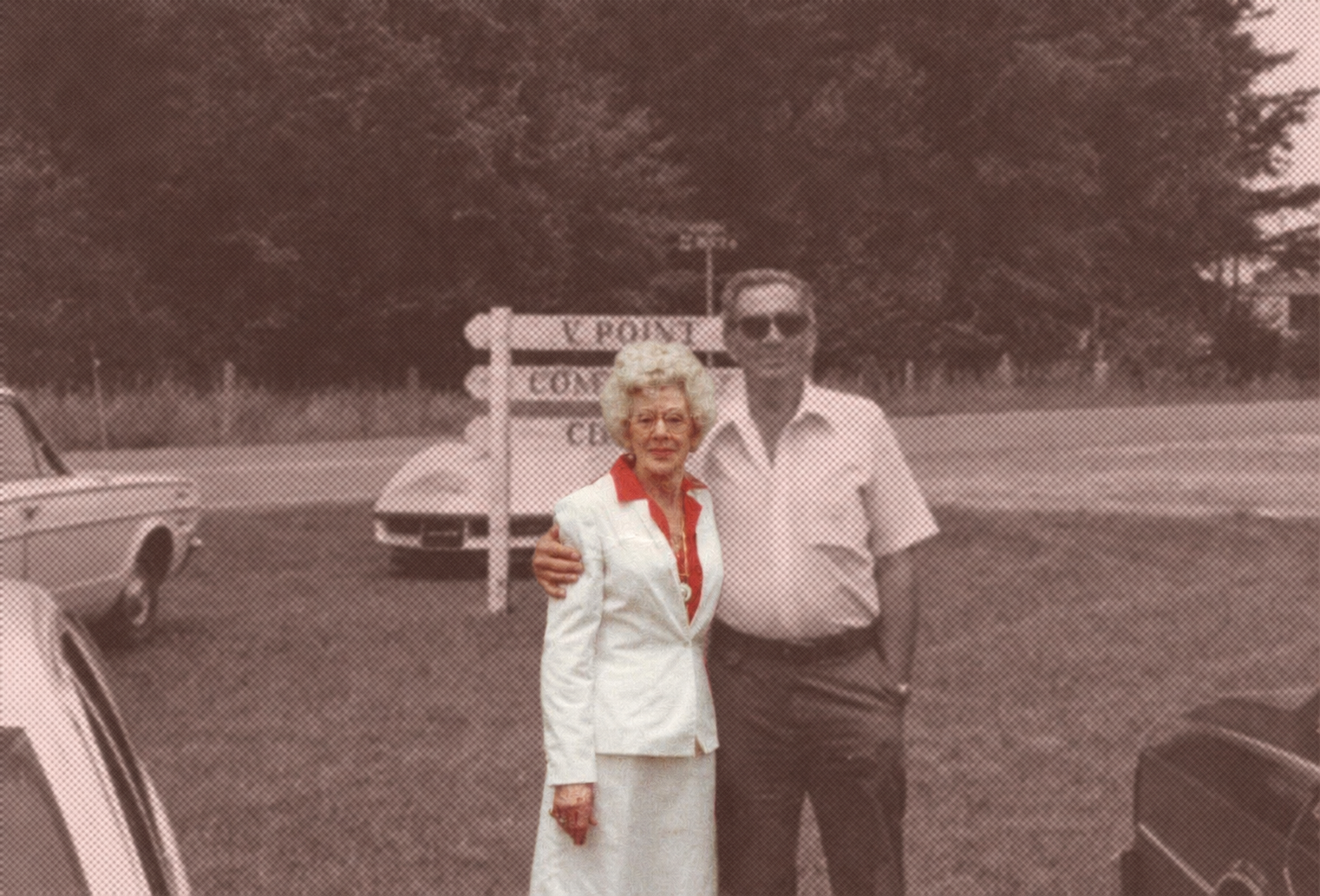 Aunt Beaut, the matriarch behind Bossy Beaut's, standing outside in a white suit